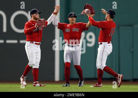 Boston Red Sox players, from left, Tommy Pham, Enrique Hernandez and Alex  Verdugo celebrate after beating