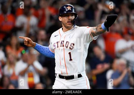 Houston Astros Yuli Gurriel (L) scores against New York Yankees catcher  Gary Sanchez in the fifth inning on a double by teammate Brian McCan in  game 7 of the American League Championship