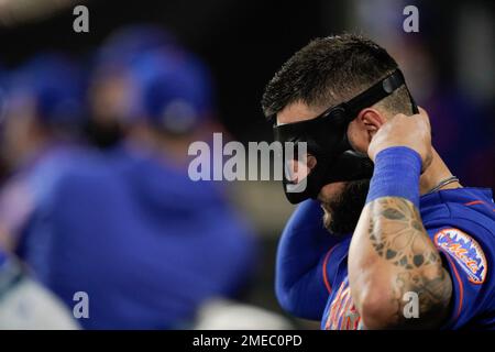 New York Mets left fielder Kevin Pillar adjusts his protective mask during  the fourth inning of a baseball game against the Baltimore Orioles,  Wednesday, June 9, 2021, in Baltimore. (AP Photo/Julio Cortez
