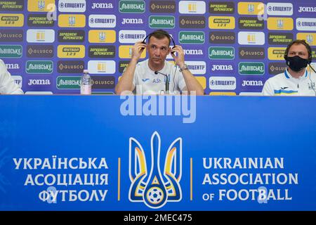 Ukraine's national soccer team head coach Andriy Shevchenko, listens to questions, next to goalkeeper Andriy Pyatov during a press conference in Bucharest, Romania, Wednesday, June 9, 2021 two days before the start of Euro 2020 soccer championship. A tense tug-of-war between Russia and Ukraine has spread to soccer, with Russian officials and lawmakers denouncing the design of the Ukrainian national team's shirt for this month's European Championship. (AP Photo/Vadim Ghirda)