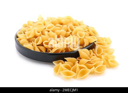 Plate of raw conchiglioni pasta isolated on white background Stock Photo