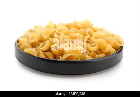 Plate of raw conchiglioni pasta isolated on white background Stock Photo