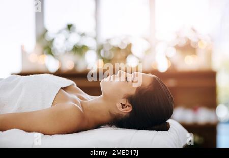 Everyone deserves to be pampered. an attractive young woman getting pampered at a beauty spa. Stock Photo