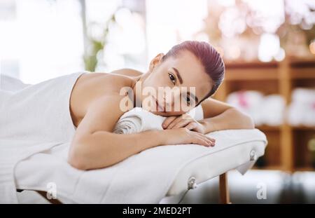 The spa is the place to be. Portrait of an attractive young woman getting pampered at a beauty spa. Stock Photo