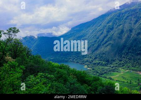 Panoramic View to the Blue Mountain Lake among the Green Forest Trees in the heart of Bosnia and Herzegovina Stock Photo