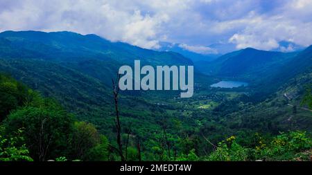 Panoramic View to the Blue Mountain Lake among the Green Forest Trees in the heart of Bosnia and Herzegovina Stock Photo