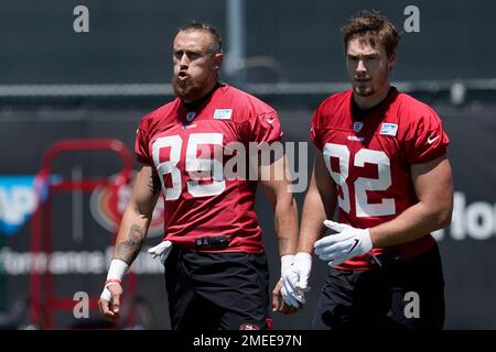 San Francisco 49ers tight ends Vance McDonald (89) and Garrett Celek (88)  take a knee following guard, Mike Iupati's (77) game ending injury during  the NFC Championship Game against the Seattle Seahawks