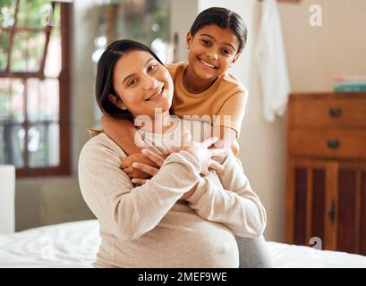 Hug, pregnant and portrait of mother and daughter in bedroom for relax, bonding and quality time. Health, support and happiness with mom and girl Stock Photo