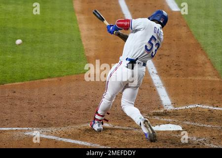 Texas Rangers right fielder Adolis Garcia walks off the field in between  innings against the Seattle Mariners in a baseball game Monday, May 8,  2023, in Seattle. (AP Photo/Lindsey Wasson Stock Photo 