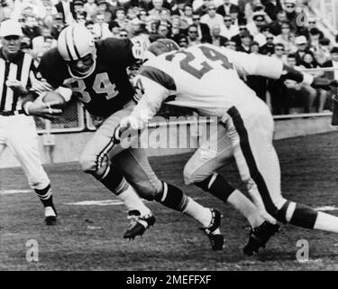 Green Bay Packers' Carroll Dale (84) is pushed and tripped out of bounds by Detroit  Lions' Lem Barney in game at Green Bay, Sept. 29, 1968. Dale had just  caught Bart Starr's