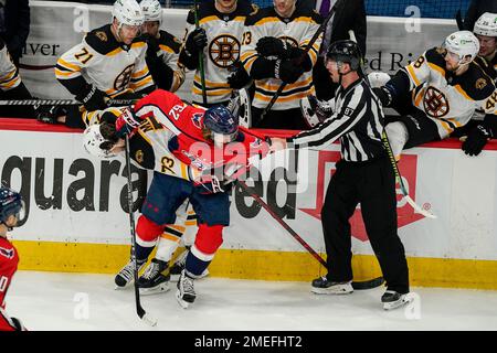 Arizona Coyotes defenseman Josh Brown (3) lands a punch during a fight  against San Jose Sharks center Michael Eyssimont as linesman Devin Berg,  left, looks on during the first period of an