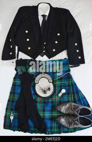 My traditional wedding suit. a traditional Scottish formal suit resting against a white background. Stock Photo