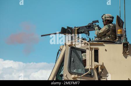U.S. Soldiers assigned to 299th Brigade Support Battalion, 2nd Armored Brigade Combat Team, 1st Infantry Division fires a mounted M2 Browning .50 caliber machine gun during a live fire exercise during Decisive Action Rotation 22-09 at the National Training Center, Fort Irwin, Calif., Aug. 16th, 2022. Stock Photo