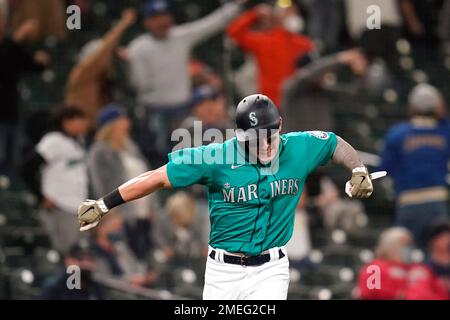 Mitch Haniger of the Seattle Mariners reacts after hitting a two-run single  in the eighth inning of a game against the Los Angeles Angels on Oct. 2,  2021, at T-Mobile Park in