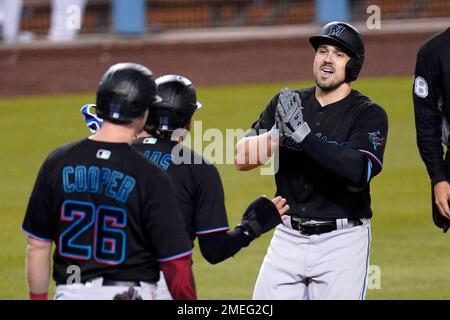 Miami Marlins left fielder Adam Duvall (14) rounds third base after hitting  a 3 run home run during a MLB game against the Los Angeles Dodgers, Sunday  Stock Photo - Alamy