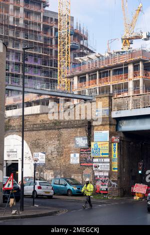 The tall high-rise residential development  called Higgs Yard, rises with more storeys above existing local arches businesses on Hardess Street at Loughborough Junction in Lambeth, south London, on 23rd January 2023, in London, England. Higgs Yard will be a residential-led mixed-use development on the Higgs Industrial Estate in Loughborough Junction, London SE24. 134 new homes and 4,150m2 of commercial floorspace. 50% of the homes will be affordable. Stock Photo