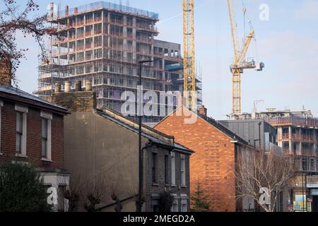 The tall high-rise residential development  called Higgs Yard, rises with more storeys above existing local housing on Herne Hill in Lambeth, south London, on 23rd January 2023, in London, England. Higgs Yard will be a residential-led mixed-use development on the Higgs Industrial Estate in Loughborough Junction, London SE24. 134 new homes and 4,150m2 of commercial floorspace. 50% of the homes will be affordable. Stock Photo