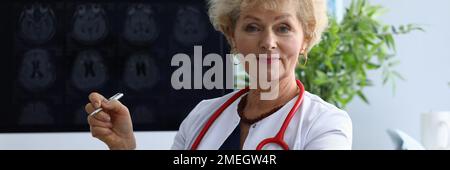 Portrait of elderly woman doctor in field of medicine Stock Photo