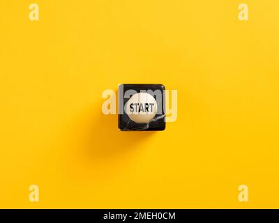 The word start on a marble cube. To make a new start in life, business, education or career concept. Start button. Stock Photo
