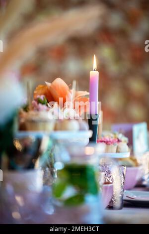 Table setting at a luxury wedding or party, babyshower, birthday and Beautiful flowers, cake,candles decortation on the table. Stock Photo
