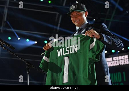 BYU quarterback Zach Wilson holds a New York Jets jersey on stage after  being selected second overall in the first round of the NFL football draft,  Thursday, April 29, 2021, in Cleveland. (