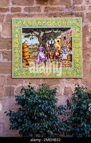 Colorful ceramic tiles on a house wall, characteristic of this art form in the town of Sciacca. Stock Photo