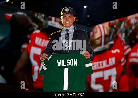 BYU quarterback Zach Wilson holds a New York Jets jersey on stage after  being selected second overall in the first round of the NFL football draft,  Thursday, April 29, 2021, in Cleveland. (