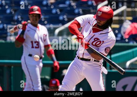 May 3 2022: Washington first baseman Josh Bell (19) hits a homer during the  game with Washington Nationals and Colorado Rockies held at Coors Field in  Denver Co. David Seelig/Cal Sport Medi