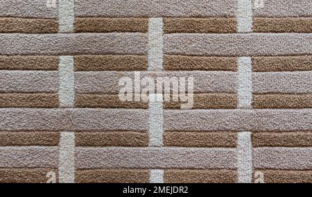 Background of brown and grey striped carpet texture. Stock Photo