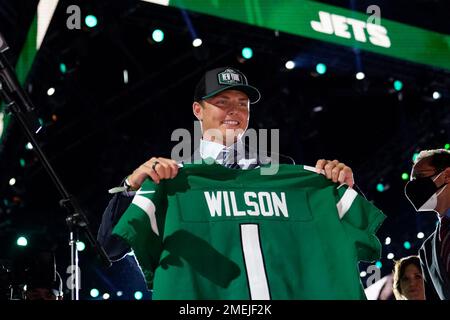 BYU quarterback Zach Wilson holds a New York Jets jersey on stage after  being selected second overall in the first round of the NFL football draft,  Thursday, April 29, 2021, in Cleveland. (