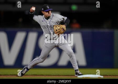 Colorado Rockies shortstop Alan Trejo (13) crosses home plate