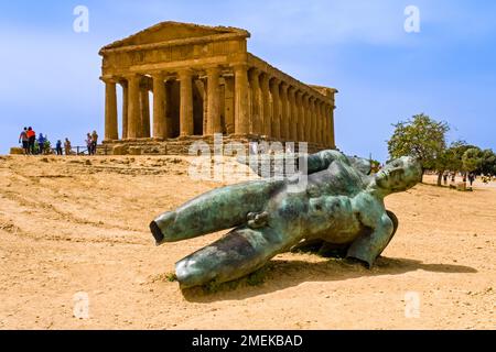 Icarus statue in front of  the Temple of Concordia, Tempio della Concordia, in the Valley of the Temples, Valle dei Templi, an archaeological site in Stock Photo