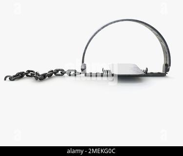 A Metal Animal Trap That Is Open Attached To The Ground With A Metal Chain  On An Isolated Background Stock Photo, Picture and Royalty Free Image.  Image 22348021.