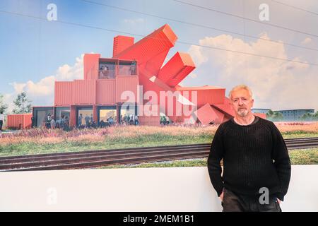 London, UK. 24th Jan, 2023. David Mach with an image of the design for his first building, an arts and events venue made of shipping containers in Edinburgh. Scottish sculptor David Mach returns to London to showcase monumental pieces in his exhibition Heavy Metal, displayed with Pangolin London until 25th March 2023. Credit: Imageplotter/Alamy Live News Stock Photo