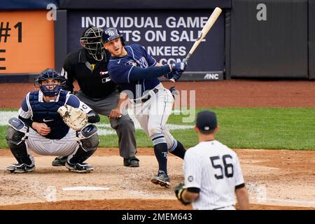 BALTIMORE, MD - AUGUST 7 New York Yankees catcher Kyle Higashioka (66) is  congratulated in the dugout after hitting a three run home run in the  fourth inning during the game between