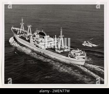 A Coast Guard helicopter performs a rescue operation, saving sailors ...