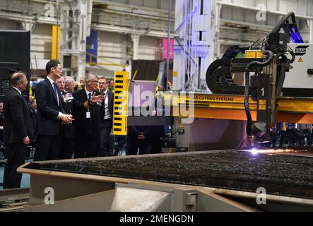 Alex Chalk, Minister for Defence Procurement(second left) alongside Martin Connell, The Second Sea Lord as the first cut of steel for the Royal Navy frigate, HMS Active, the Royal Navy's second in class Type 31 frigate is made at Babcock International at Rosyth Dockyard on the Firth of Forth at Rosyth, Fife. Picture date: Tuesday January 24, 2023. Stock Photo