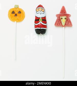 Two jelly lollies, one shaped like a pumpkin and one like a witch. Stock Photo