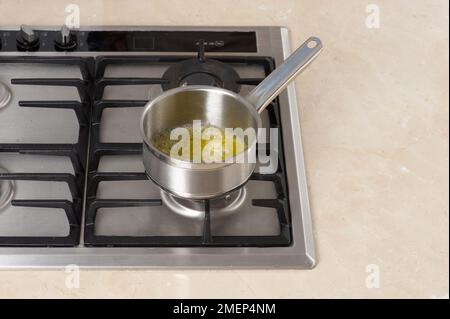 Melting butter in pan Stock Photo