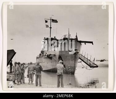 A Coast Guard infantry landing craft (LCI) is shown stranded on a ...