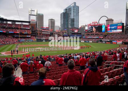 members of the St. Louis Cardinals stand for the National Anthem in their  1982 blue uniforms before a game against the Milwaukee Brewers at Busch  Stadium in St. Louis on August 5