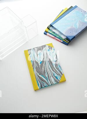Marbled book cover with yellow corners, close-up Stock Photo