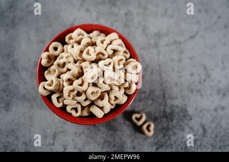 Heart shaped cereal valentines day background, selective focus Stock Photo