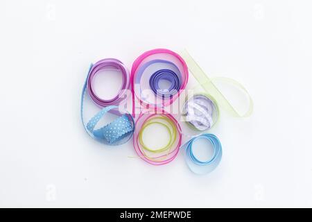 Ribbons in various widths and colours, overhead view Stock Photo