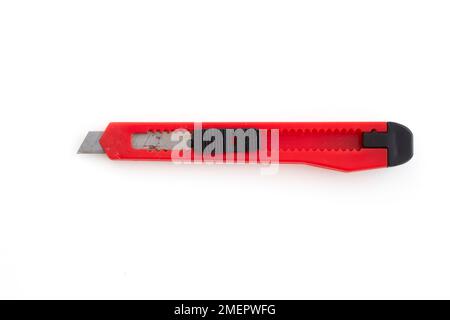 Utility knife on white background, close-up Stock Photo