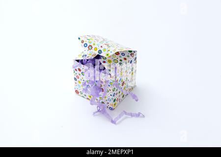 Small handmade box lined tissue paper 'straw' Stock Photo