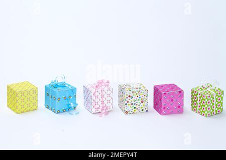 Row of small handmade gift boxes, close-up Stock Photo