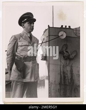 Photograph of Member of U.S. Coast Guard Volunteer Port Security Force. The U.S. Coast Guard Volunteer Port Security Force members are men from all walks of life, and stand two six hour watches a week, and know how to use the side arms they carry if the occasion arises. Stock Photo