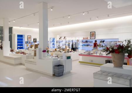 Visitors look around and shop in the modern underground museum shop in the Drents Museum in Assen, the Netherlands Stock Photo