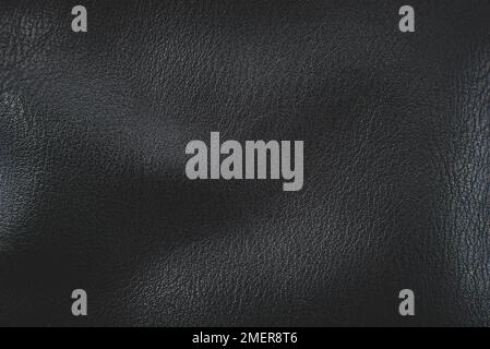 Black artificial leather texture close up. Leather Stock Photo